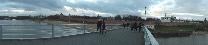 Достопримечательности Великого Новгорода. Пешеходный мост через Волхов (Горбатый мост). Панорама кремля